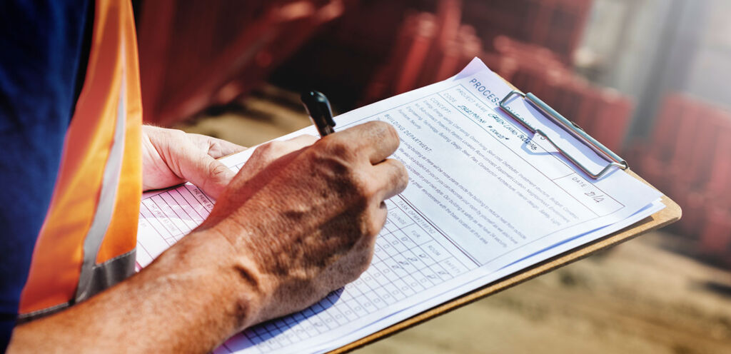 Man writing OHS Documentation